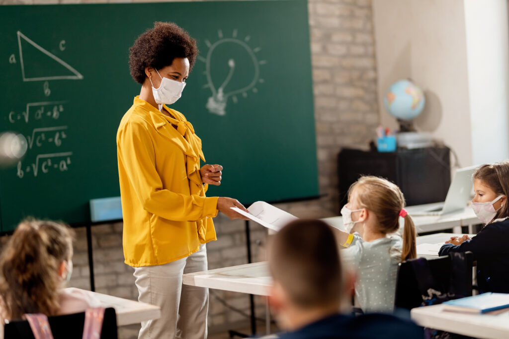 Teacher wearing mask in the classroom